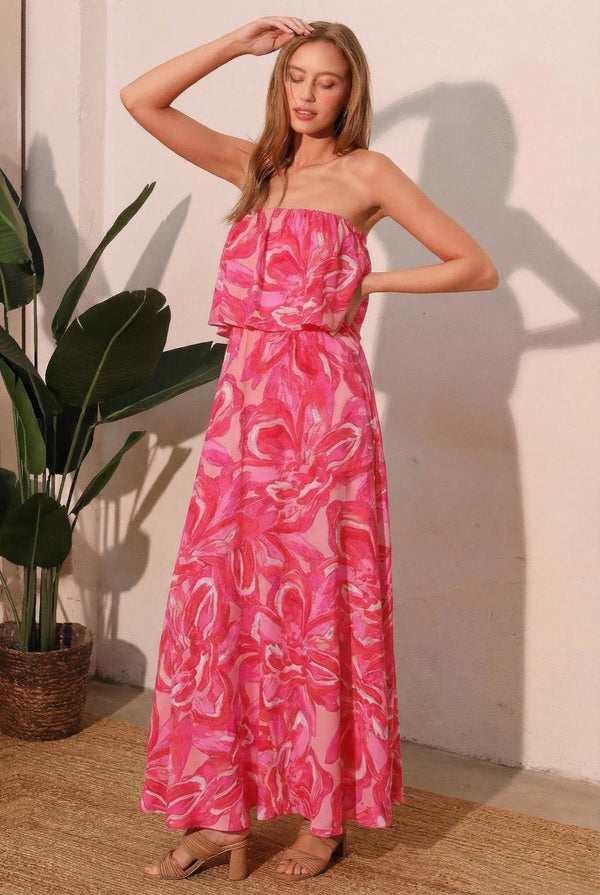 Strapless maxi dress in bright pink with white floral pattern, ruched bodice